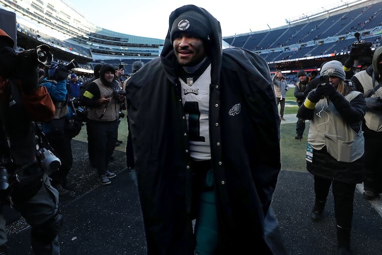 Eagles quarterback Jalen Hurts walks off the field after the team's 25-20 victory Sunday over the Bears at Soldier Field.