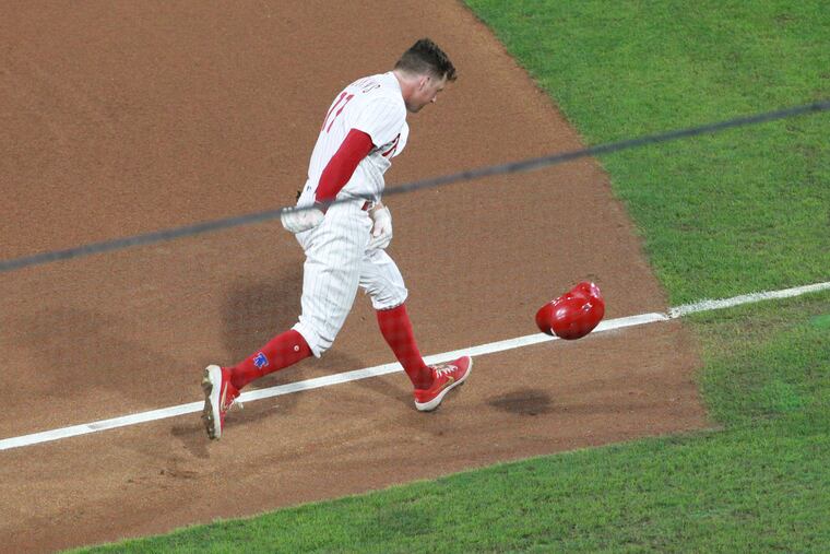 Phillies first baseman Rhys Hoskins throws his batting helmet to the ground after hitting into a double play to end the fourth inning Wednesday night.