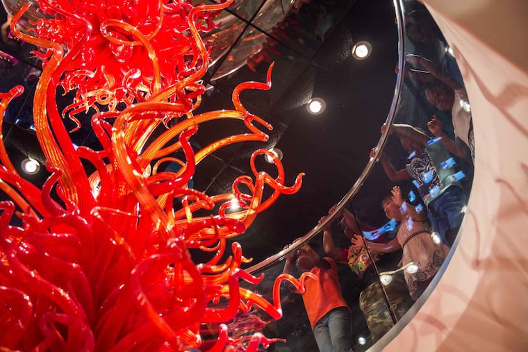 In this 2017 file photo, children view the "Flame of Liberty" glass sculpture at the National Liberty Museum in Old City. Alaine Arnott, the president of the museum, writes that we need to model the courage to connect across differences.