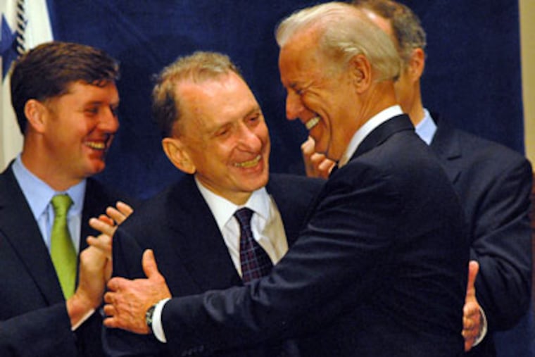 At a University of Pennsylvania reception honoring Sen. Arlen Specter for casting a decisive vote on the stimulus package, the Republican gets a hug from Vice President Joe Biden. At left is U.S. Rep. Patrick Murphy, a Bucks County Democrat. (April Saul / Staff Photographer)
