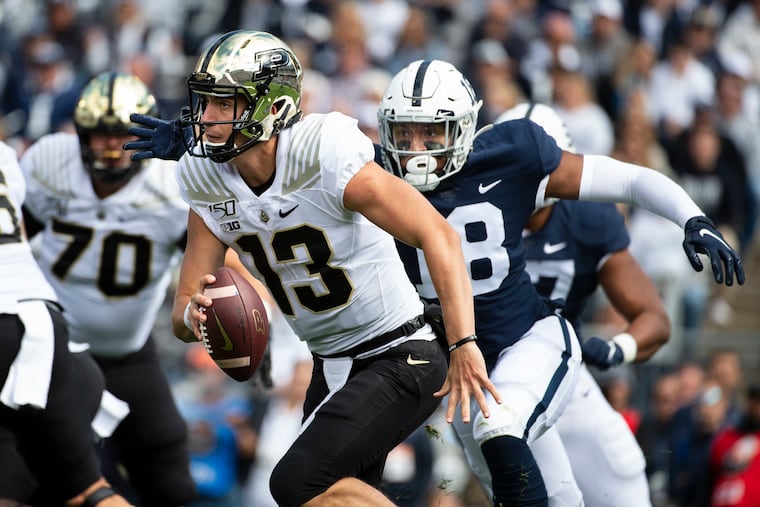 Penn State defensive end Shaka Toney (18), chasing Purdue quarterback Peyton Ramsey in a game earlier this season, and his teammates have accepted a Cotton Bowl bid to play Memphis on Dec. 28. (AP Photo/Barry Reeger)