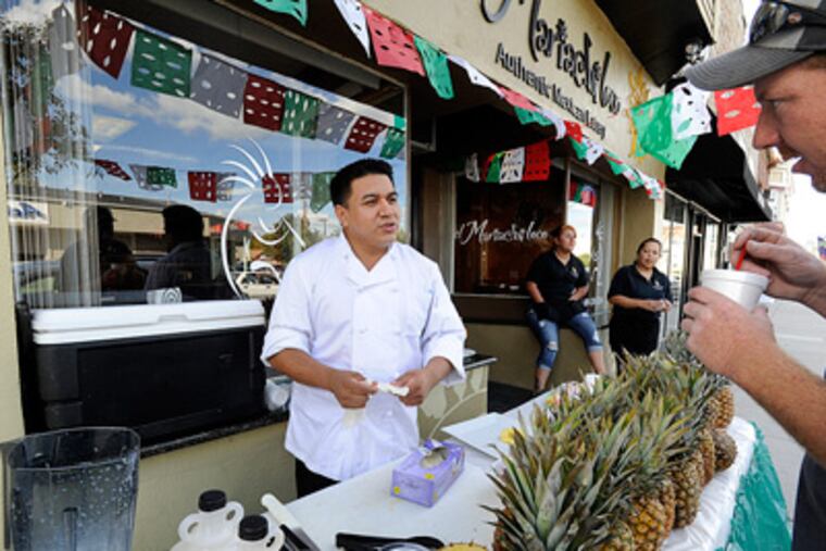Hammonton is an enclave of Mexican food. Owner Roberto Diaz of El Mariachi Loco, makes non-alcoholic pina coladas outside his restaurant. (SHARON GEKOSKI-KIMMEL / Staff Photographer)