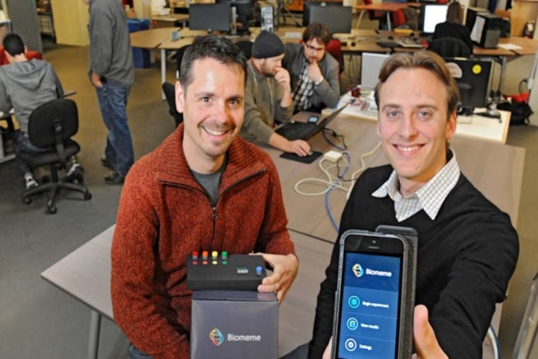 Max Perelman (front left), 37, and Jesse vanWestrienen (30, cq) two of the three founders of Biomeme, a Philadelphia-based bio-tech start-up which is working on a mobile DNA device and software which will bring DNA sequencing to the masses via their iPhone of iPod. In the background (center) is third founder Marc DeJohn (left with hat on), 44, lead engineer and Maximillian Maksutovic, 26, lead software engineer. They are in NextFab Studio on Washington Ave. ( CLEM MURRAY / Staff Photographer )