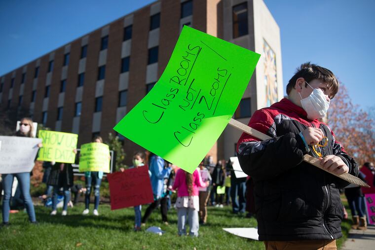 Colin McAndrew, 9, a fourth grader at North Penn, holds a sign that reads “Classrooms not Class Zooms” during a rally held outside of the Montgomery County Human Services Center in Norristown on Saturday, Nov. 14, 2020. With delta cases rising, debate has reignited about how best to reopen classrooms in fall 2021.