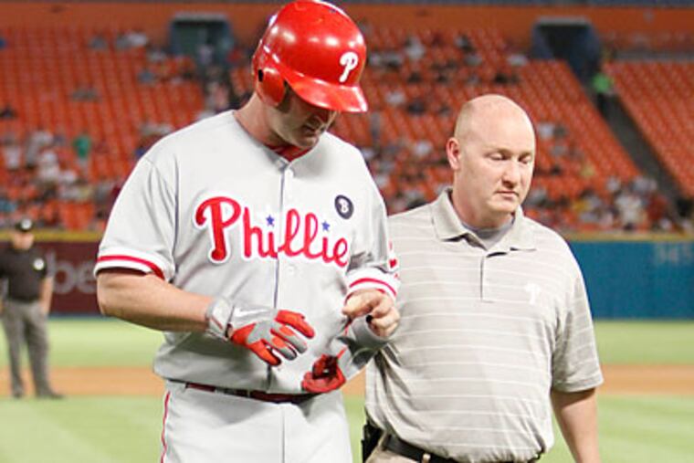 Brian Schneider left the game after straining his left hamstring in the fifth inning. (Alan Diaz/AP)