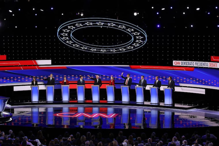 From left, Democratic presidential candidates Marianne Williamson, Rep. Tim Ryan (D-Ohio), Sen. Amy Klobuchar (D-Minn.), Indiana Mayor Pete Buttigieg, Sen. Bernie Sanders (I-Vt.), Sen. Elizabeth Warren (D-Mass.), former Texas congressman Beto O'Rourke, former Colorado governor John Hickenlooper, and Montana Gov. Steve Bullock during the Democratic presidential debate at the Fox Theatre in Detroit on Tuesday, July 30, 2019.
