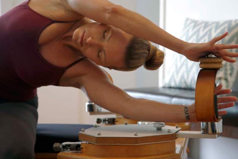 Danielle Thulin does an exercise routine on the gyrotonic tower machine on Jan. 26, 2015 in Los Angeles. (Katie Falkenberg/Los Angeles Times/TNS)