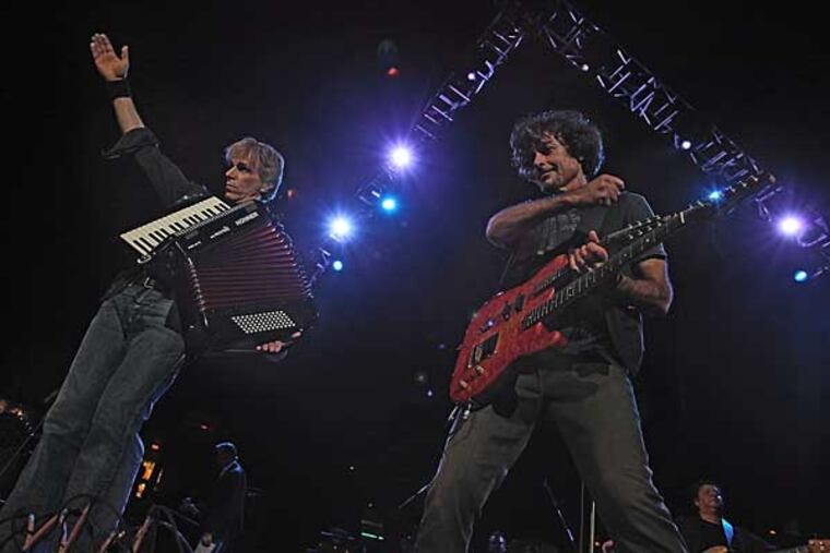 Rob Hyman, accordian and Eric Bazilian, mandolin/guitar, front the Hooters at the Spectrum, Oct. 23, 2009. ( David M Warren / Staff Photographer )