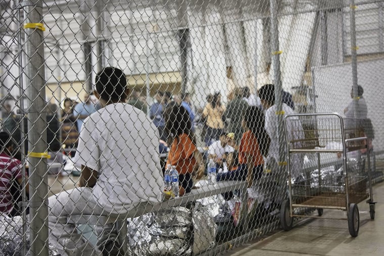 In this photo provided by U.S. Customs and Border Protection, people who've been taken into custody related to cases of illegal entry into the United States, sit in one of the cages at a facility in McAllen, Texas, Sunday, June 17, 2018. More than 2,300 minors have been separated from their parents since April, when the Trump administration launched its "zero-tolerance" policy that called for prosecuting illegal immigrants and taking their children away.