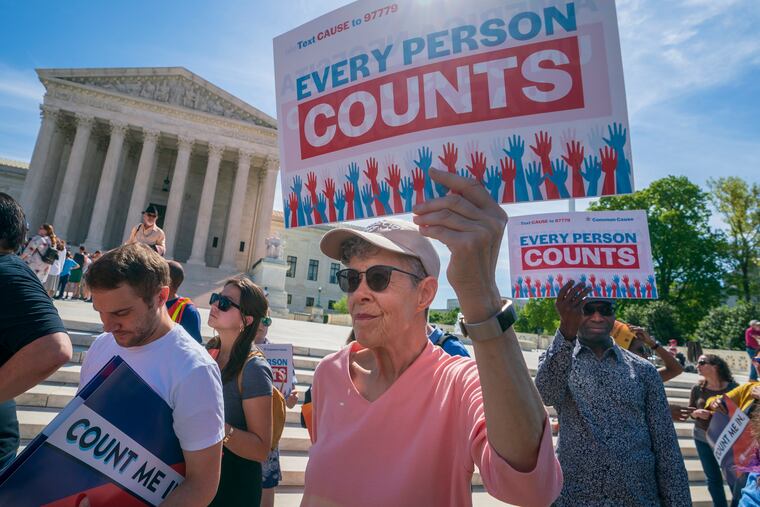 FILE - In this April 23, 2019, file photo, immigration activists rally outside the Supreme Court as the justices hear arguments over the Trump administration's plan to ask about citizenship on the 2020 census, in Washington.