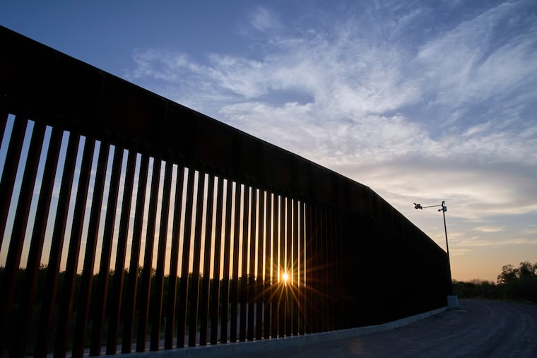 The sun sets over a section of the border wall, June 18, 2025, in Mission, Texas. DHS continues building the wall despite record low rates of border crossings.
