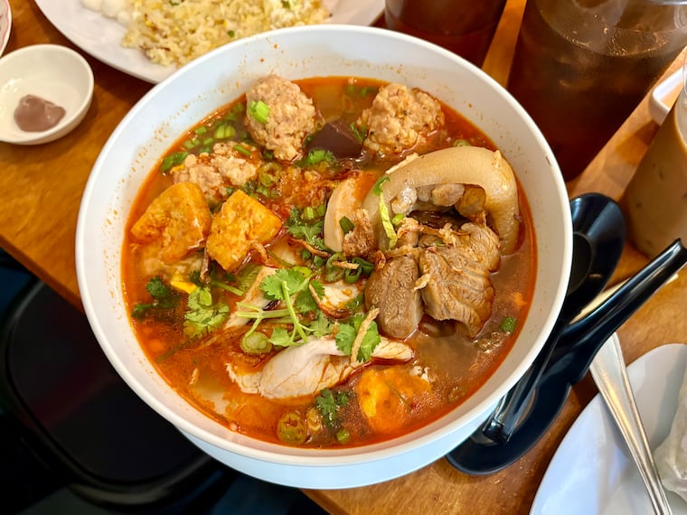 The crab noodle soup at Phở Duyên, bún riêu, is filled with seafood meatballs, assorted meats, and a broth that shimmers with spice.