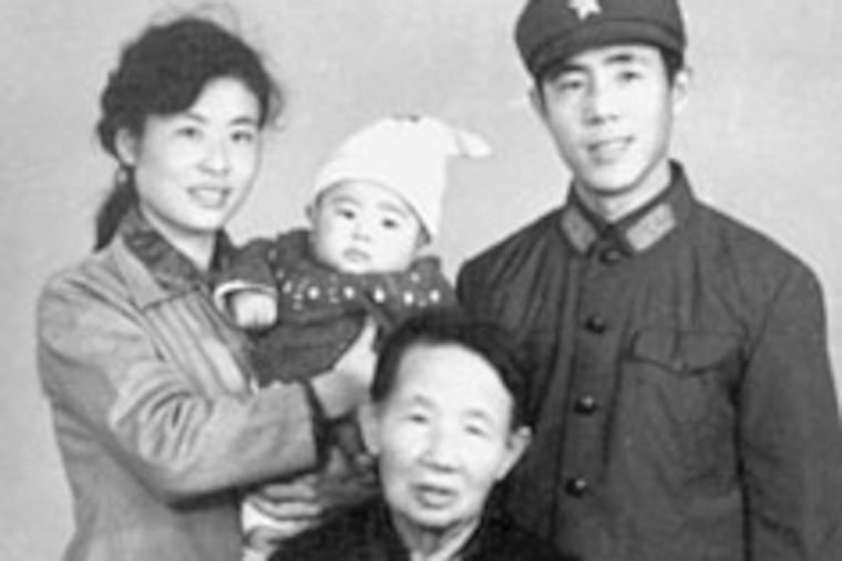 Lang Lang with his parents and maternal grandmother. His father says everything in the book is true.