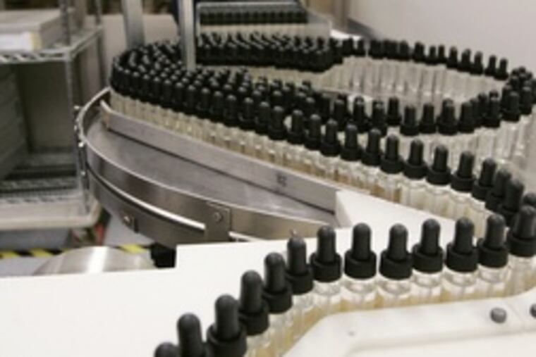 Technician at Ortho-Clinical Diagnostics, a J&J unit, in Raritan, N.J. The health-care giant cited a sales slump for heart stents among reasons for cutting costs. It did not say which plants would be affected.