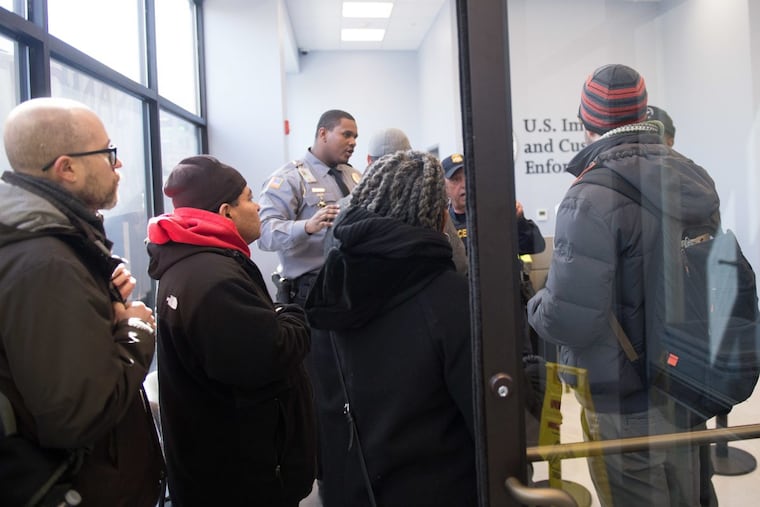 Attorney Dave Bennion, Gerardo Flores, Rev. Renee McKenzie, and New Sanctuary Movement of Philadelphia director Peter Pedemonti request admittance from ICE agents to deliver petitions on behalf of the Hernandez family.