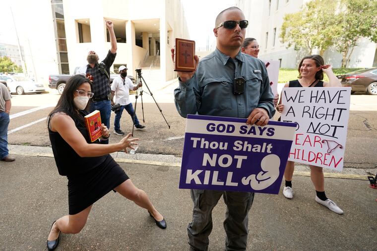 Protestors near the Hinds County Chancery Court on Tuesday in Jackson, Miss.