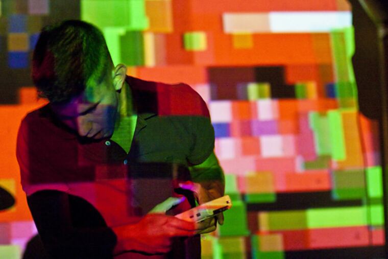 Robert Joffred performs before projections by New York’s Paris Treantafeles.