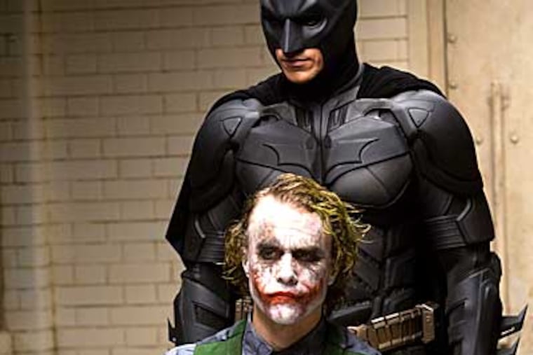 Heath Ledger, with Christian Bale as Batman, is unnervingly creepy as the Joker in "The Dark Knight."