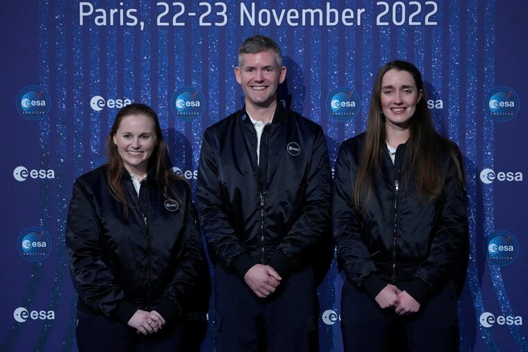ESA's new parastronaut John McFall, a British former Paralympic sprinter who will take part in a potentially groundbreaking feasibility study to explore whether physical disability will impair space travel, poses with ESA's new astronauts Meganne Christian, left, and Rosemary Coogan, right, during the ESA Council at Ministerial level (CM22) at the Grand Palais Ephemere, in Paris, Wednesday, Nov. 23, 2022. The European Space Agency has selected a disabled former athlete to be among its its newest astronaut recruits as part of its first recruitment drive in over a decade that aimed to bring diversity to space travel.