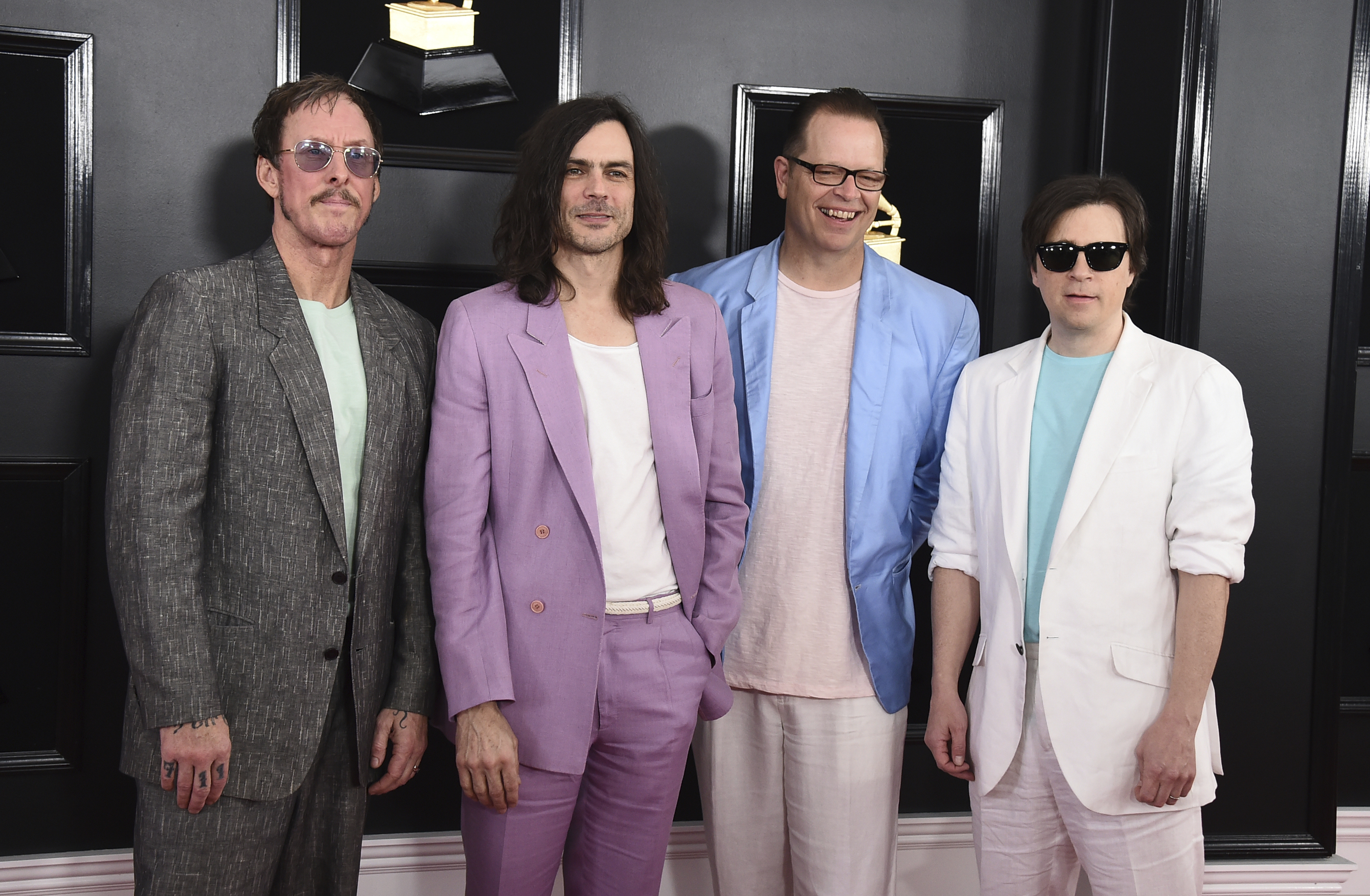 Rivers Cuomo, from left, Brian Bell, Patrick Wilson, and Scott Shriner of Weezer arrive at the 61st annual Grammy Awards at the Staples Center on Sunday, Feb. 10, 2019, in Los Angeles. (Photo by Jordan Strauss/Invision/AP)