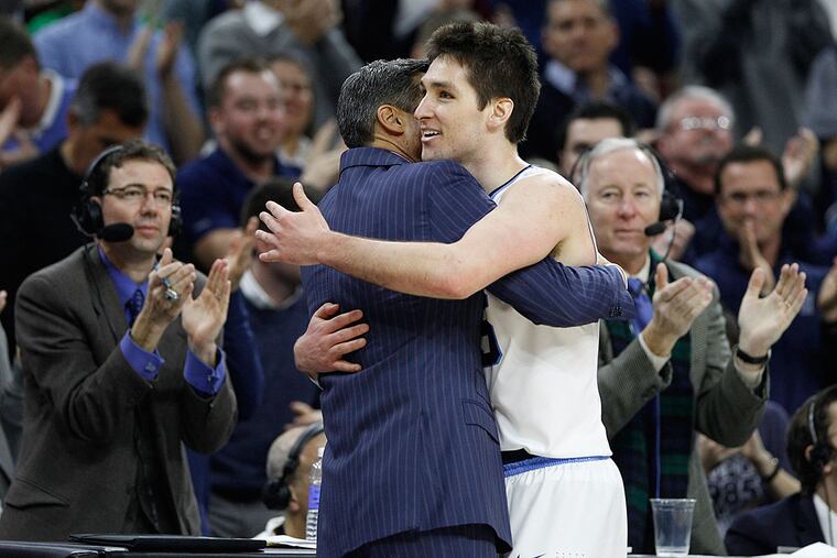 Villanova's Ryan Arcidiacono hugging head coach Jay Wright.