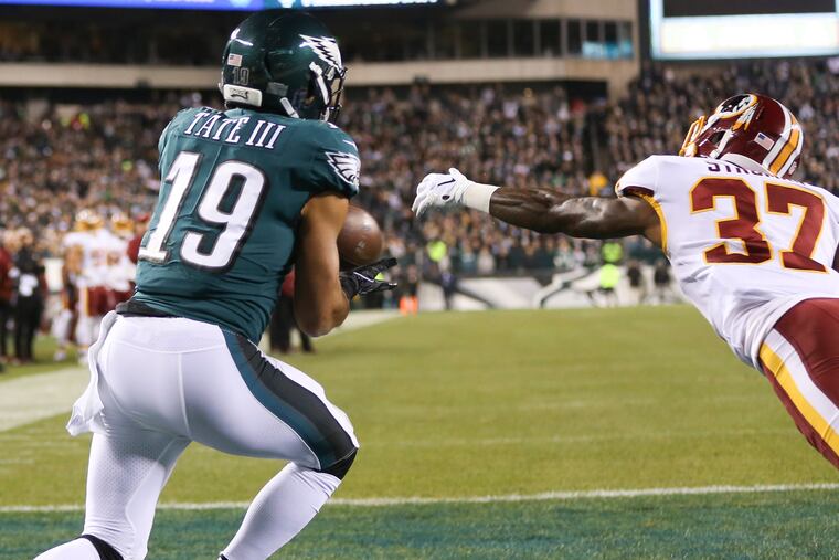 Eagles wide receiver Golden Tate catches a first-quarter touchdown past Washington cornerback Greg Stroman on Monday.