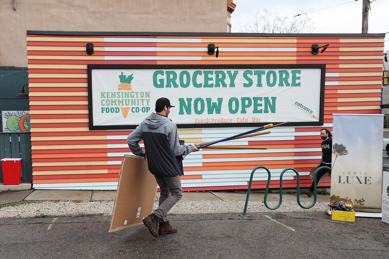 Kevin Sanborn carries clean-up equipment for a litter pick-up event up held by Kensington Community Food Co-op, Verte Luxe, and Ya Fav Trashman along Coral Street in Philadelphia, Pa. on Sunday, Jan. 2, 2022.