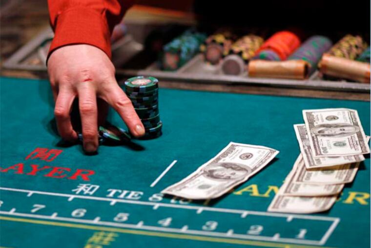 A dealer runs a table game at Parx Casino in Bensalem. (File photo: Laurence Kesterson / Staff Photographer)