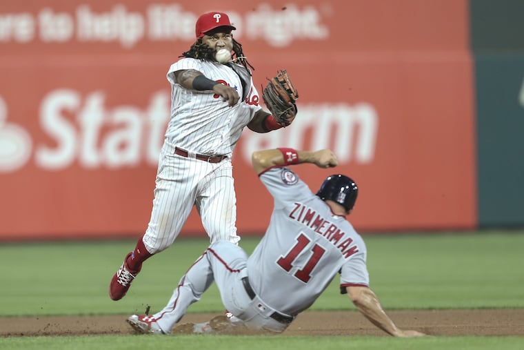 Maikel Franco tags second base ahead of Ryan Zimmerman during the Phillies-Nationals game on Monday. Franco was making the play as part of the team's defensive shift with Matt Wieters.