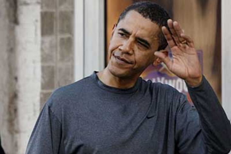 President-elect Barack Obama waves as he leaves the Philadelphia Sports Clubs following a morning workout. (AP Photo/Pablo Martinez Monsivais)