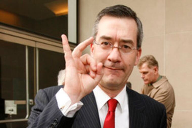 Assistant U.S. Attorney Richard Lloret, who prosecuted the case, flashes an "OK" as he leaves the U.S. Courthouse in Philadelphia.