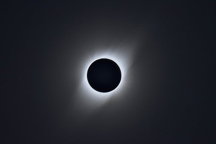 The sun's atmosphere, or corona, appears behind the moon during a total solar eclipse in Vicuña, Chile on July 2, 2019. Another total eclipse will take place Wednesday.