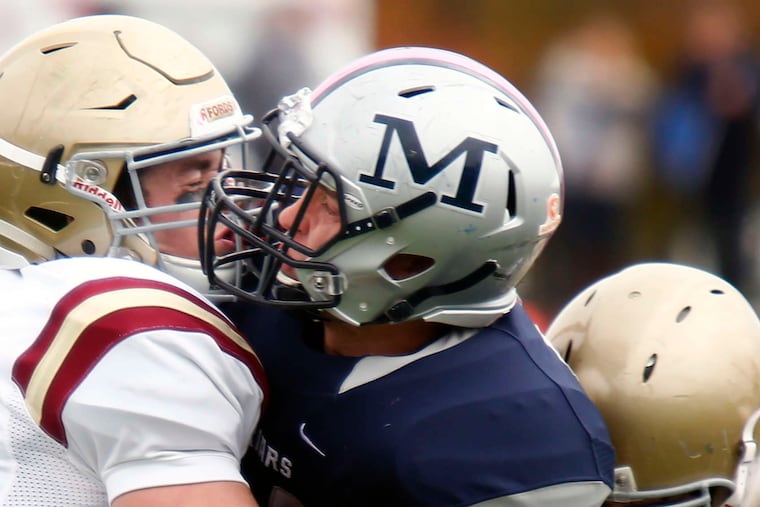 Haverford School's Mickey Kober (left) and Colin Hurlbrink tackle Malvern Prep's Mike Fay. Haverford won Saturday's Inter-Ac game, 31-14.