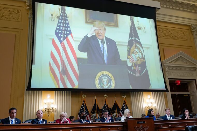 A video of former President Donald Trump plays as the House select committee investigating the Jan. 6 attack on the U.S. Capitol holds a hearing on July 21.