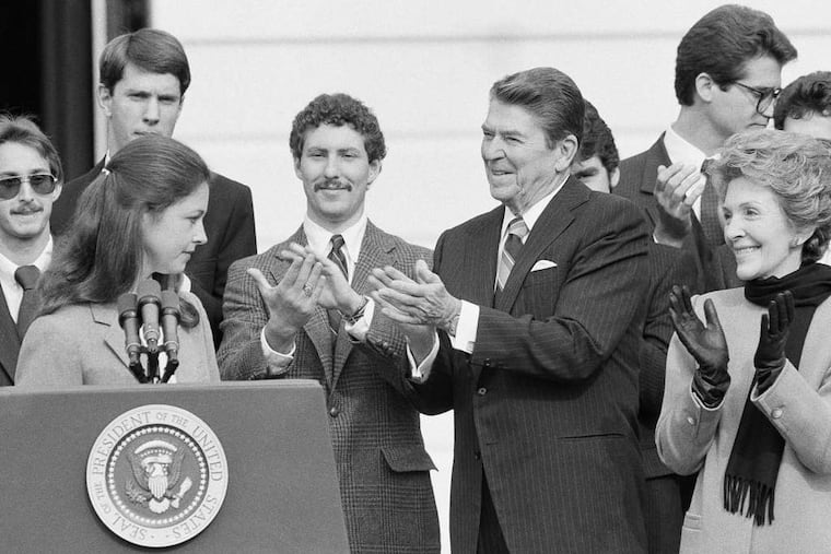 Jean Jool of Albany, N.Y., is applauded by the Reagans at the White House after she thanked the president and U.S. servicemen for rescuing her and other Americans from the Caribbean island of Grenada 30 years ago.