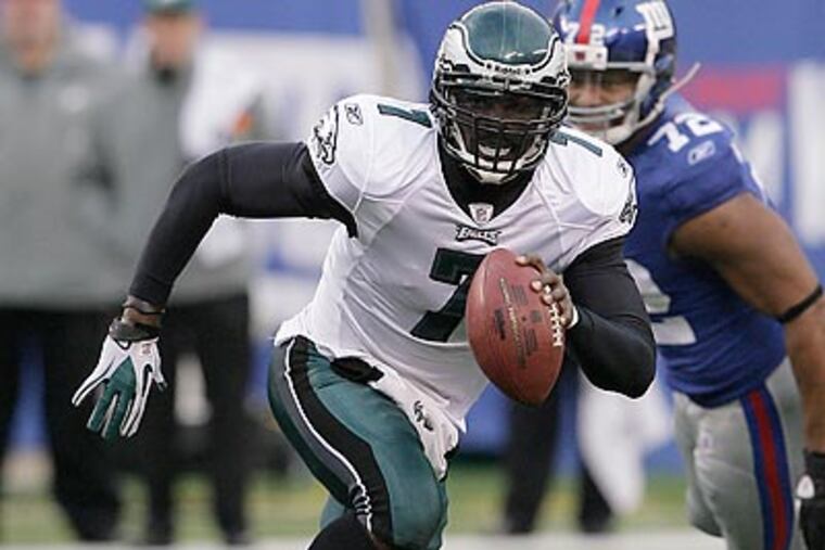 Eagles quarterback Michael Vick is guaranteed $16 million next season. (Yong Kim/Staff file photo)