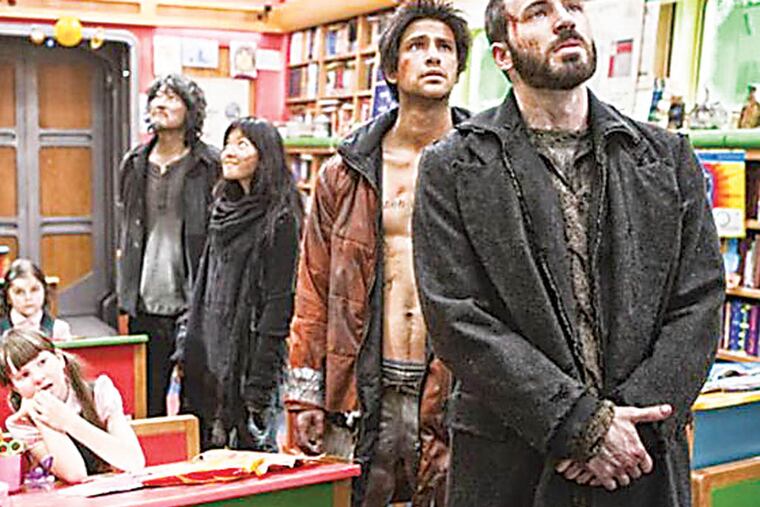 Chris Evans, Kang-ho Song and Ah-sung Ko in "Snowpiercer."
In a future where a failed global-warming experiment kills off all life on the planet except for a lucky few that boarded the Snowpiercer, a train that travels around the globe, where a class system evolves