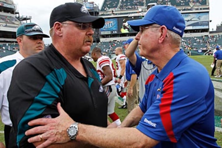 "Andy's a good football coach. He has a record to stand on to prove that," Tom Coughlin said of Andy Reid. (Alex Brandon/AP file photo)