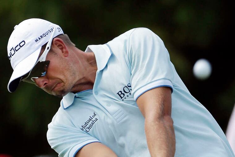 Henrik Stenson, teeing off on the second hole, benefited from a fortuitous decision to leave a damaged club in the locker room before the second round. Associated Press