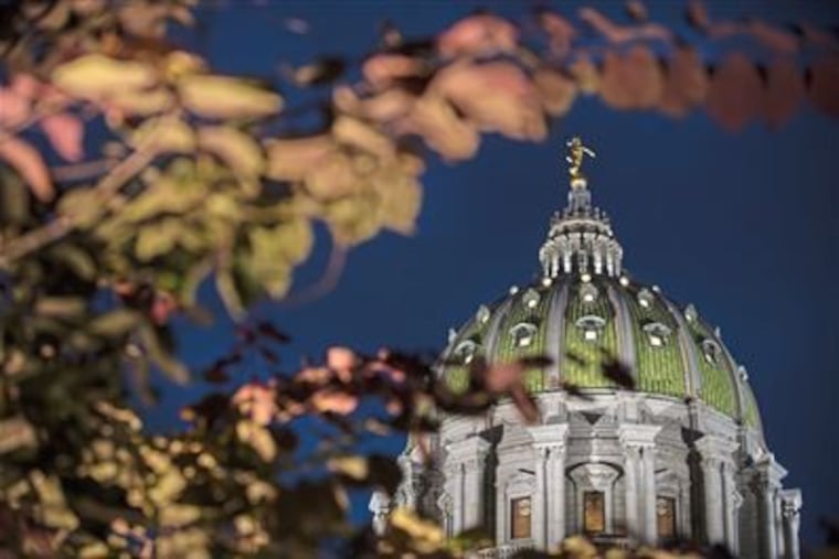 The dome on the Pennsylvania State Capitol building is lit up as dusk falls on Monday, Aug. 13, 2018 in Harrisburg.