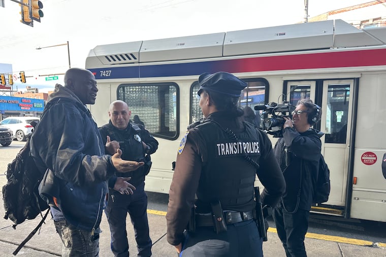 A camera operator from Double Act Productions films transit police officers on the job at the Olney Transportation Center. The company is making a TV docuseries for the A&E cable network.
