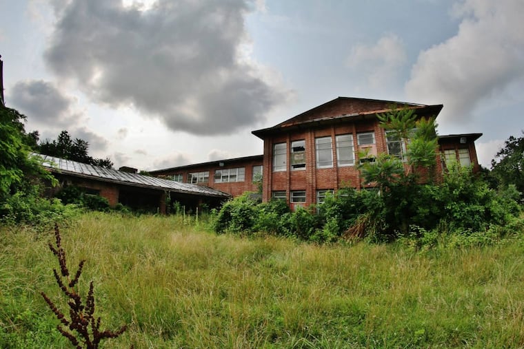 The exterior of the old Embreeville State School and Hospital in West Bradford Township in 2015. As the complex has sat unused for years, it has fallen victim to blight, trespassing, and environmental hazards.