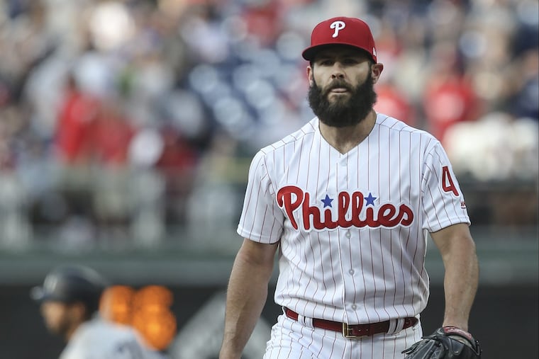 Jake Arrieta walks back to the mound as the Yankees' Aaron Hicks runs the bases following a solo home run during Tuesday's game at Citizens Bank Park.