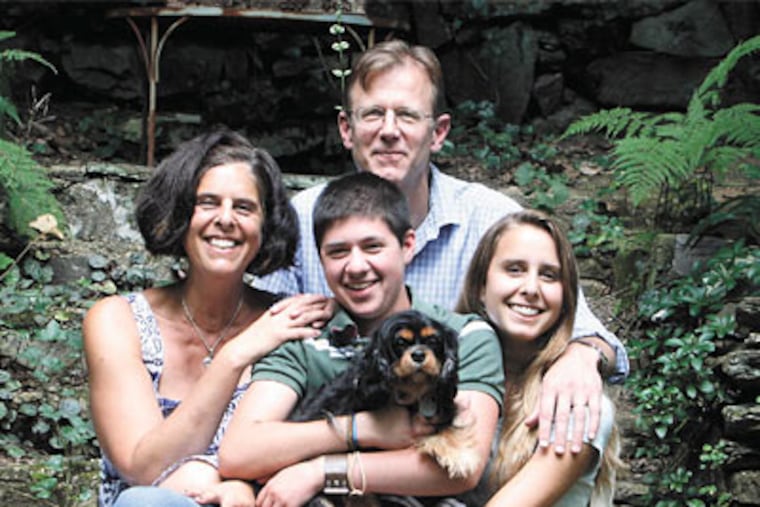Ty Clark (center) with his family, top, in their Wyncote yard: mother Rory Cohen, father Matthew Clark, sister Shane Clark, 17, and dog Cocoa. (Bonnie Weller/Staff Photographer)