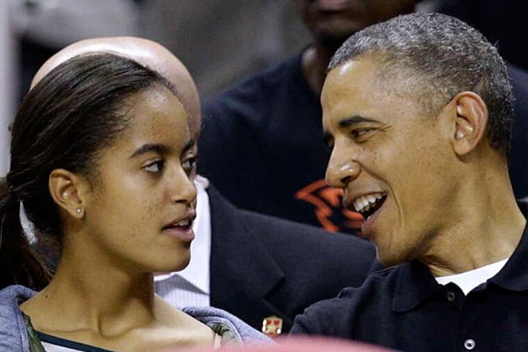 Malia Obama and her father attending an NCAA basketball game between Maryland and Oregon State in College Park, Md., in November.