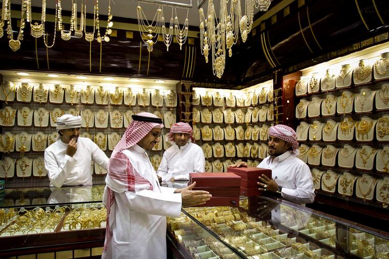 A customer from Saudi Arabia discusses his purchases. Dubai's location is key to its growth, said the head of a center that oversees the emirate's gold trade.
