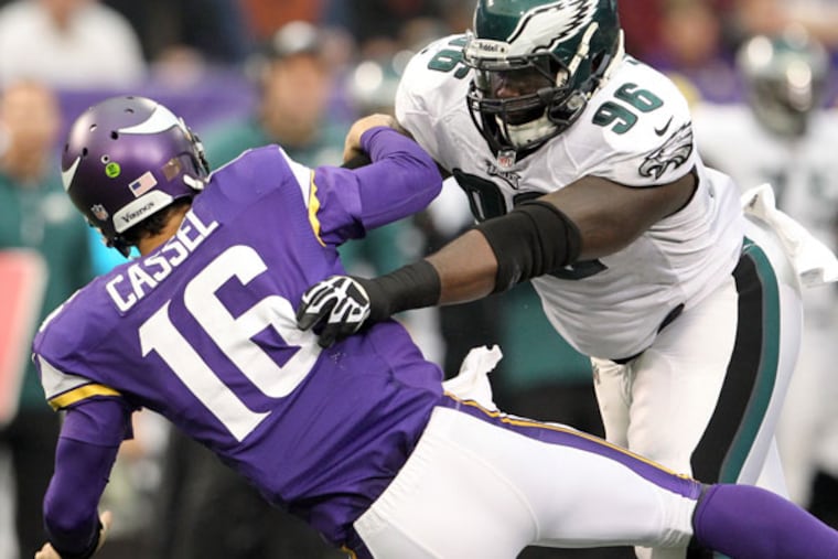 Bennie Logan knocks down VIkings quarterback Matt Cassel. (Yong Kim/Staff Photographer)