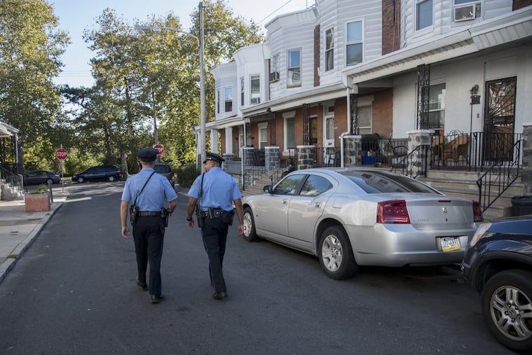 Philadelphia officers patrol North Simpson Street in the 19th Police District.
