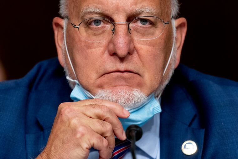 FILE - In this Wednesday, Sept. 16, 2020 file photo, the Centers for Disease Control and Prevention Director Dr. Robert Redfield pauses while speaking at a Senate Appropriations subcommittee hearing on a "Review of Coronavirus Response Efforts" on Capitol Hill in Washington. On Friday, Sept. 18, 2020, the CDC dropped a controversial piece of coronavirus guidance and said anyone who has been in close contact with an infected person should get tested. The CDC essentially returned to its previous testing guidance, getting rid of language posted last month that said people who didn't feel sick didn't need to get tested. (AP Photo/Andrew Harnik, Pool)