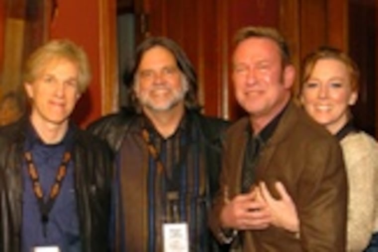 The Knowlton Mansion in North Philadelphia was the setting for Friday's Beggar's Banquet benefit. From left, musician Francis Dunnery; Eric Bazilian and Rob Hyman of the Hooters; WXPN's Roger LaMay; John Lilley of the Hooters, and Jonatha Brooke. The event raised $47,000 for the noncommercial radio station.